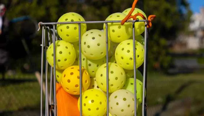 Holes in the outdoor and indoor pickleball balls