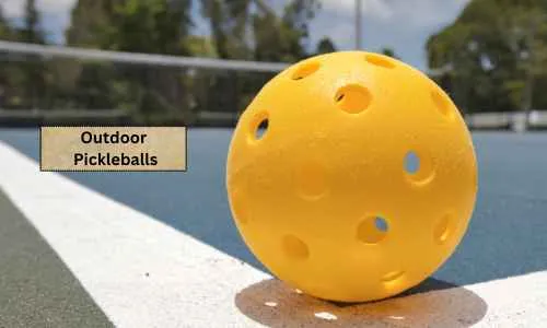 a yellow pickleball with holes on the side of the court
