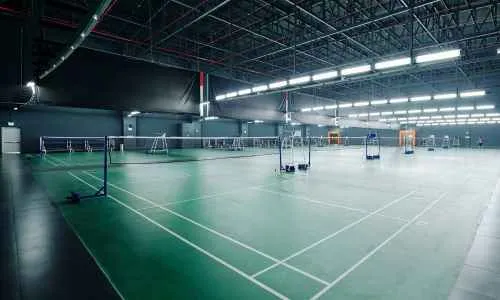 a indoor pickleball court with net
