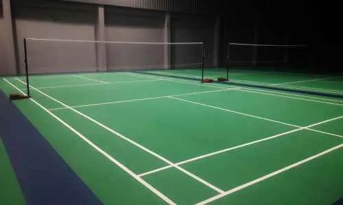 a basement pickleball court with net
