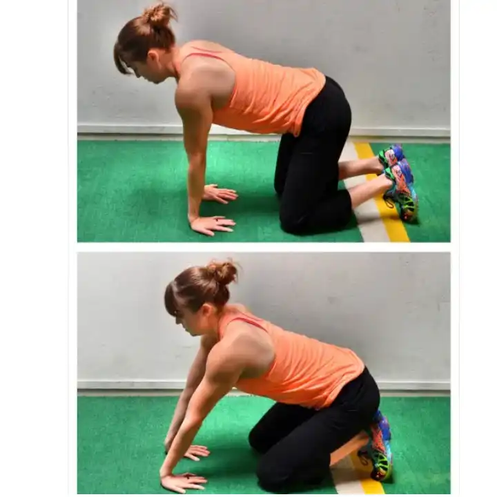 a women is doing  Kneeling Wrist Extension Stretch