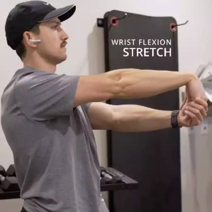 a person is doing Seated Wrist Extension Stretch
