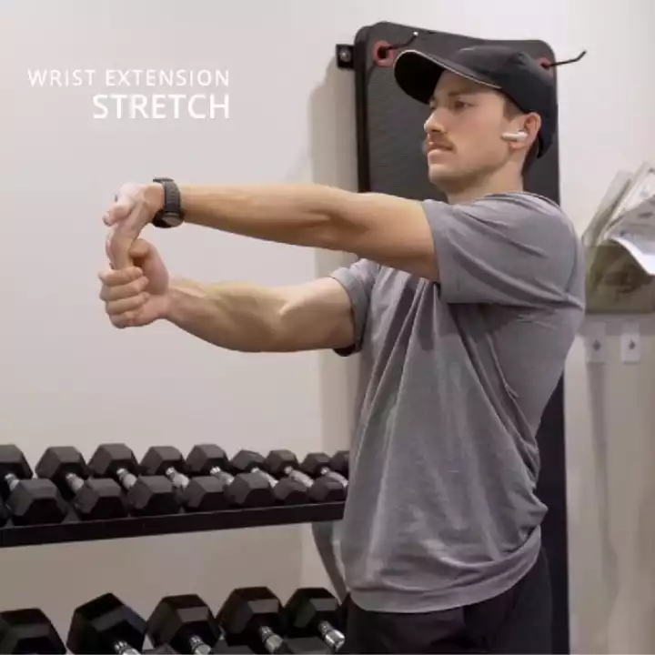 a person is doing Seated Wrist Flexion Stretch
